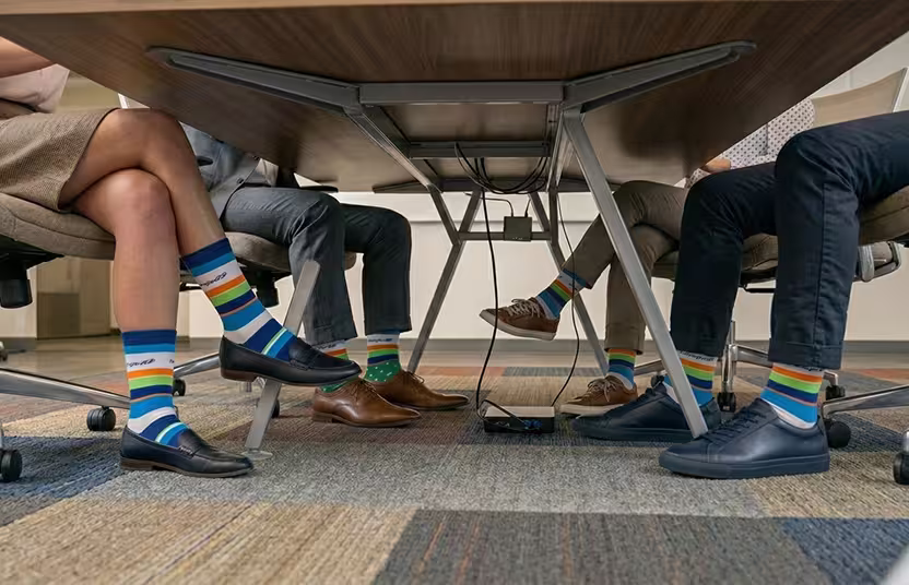 Colorful striped socks in a meeting room